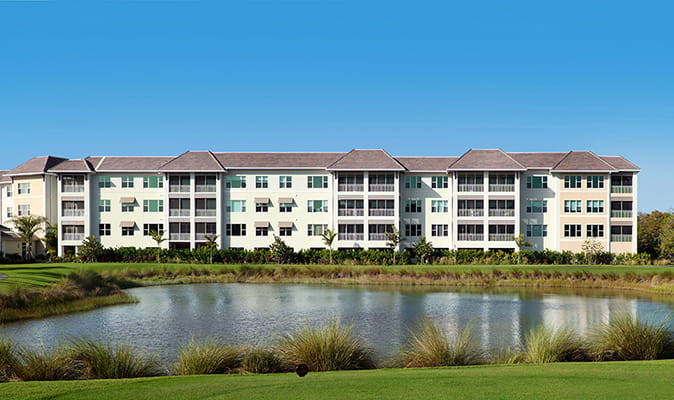 Vi at Bentley Village's new construction overlooking a lake