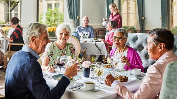 A group of seniors having dinner.