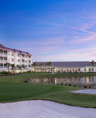 Phase 5 apartments and the East Clubhouse at dusk.