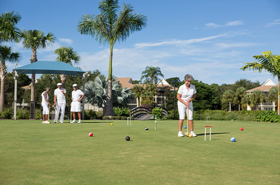 Residents playing croquet.