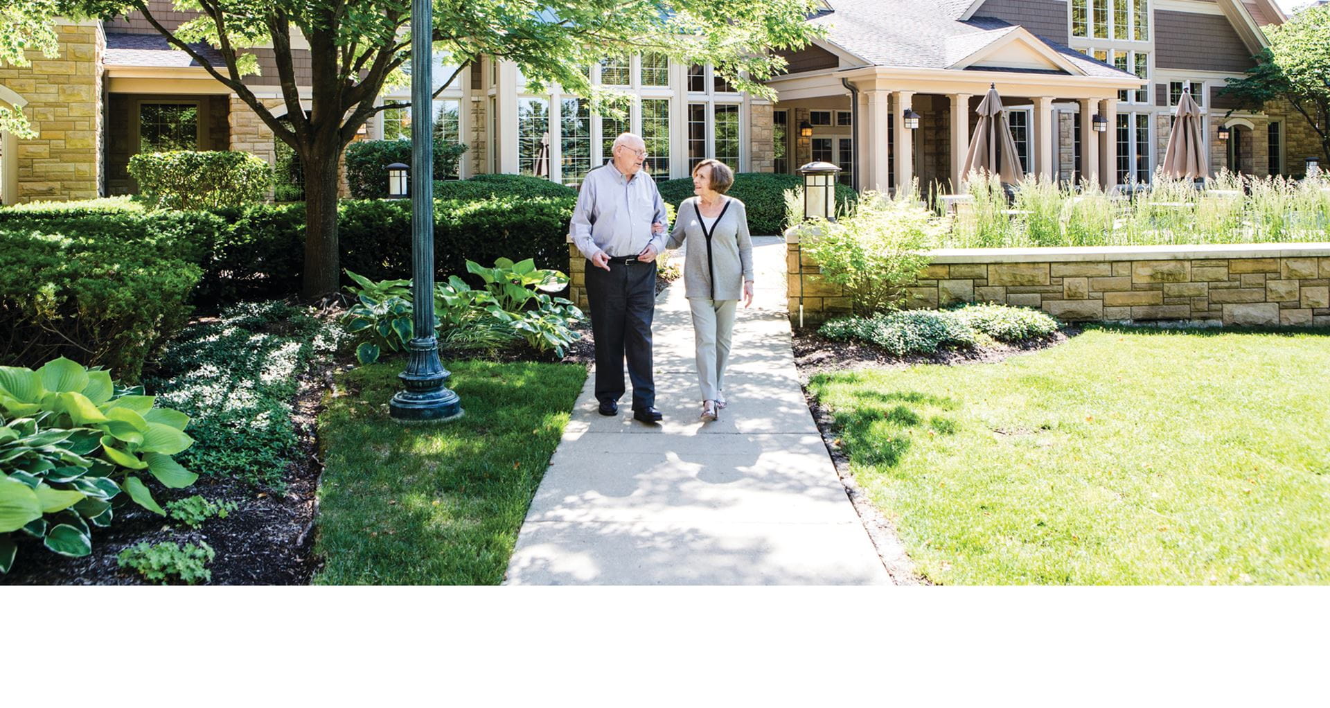 A couple walks outside at Vi.