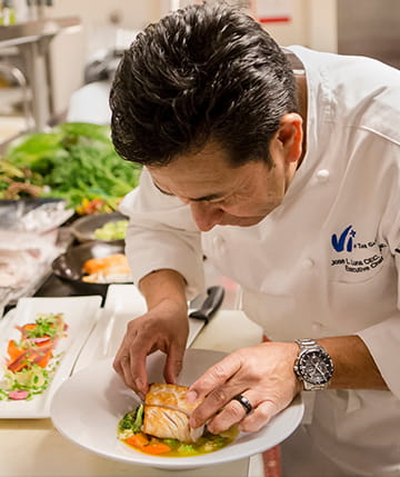 Executive Chef Jose Luna prepares a meal.