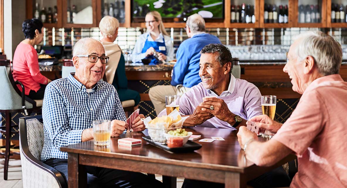 Men hanging out at the bar at Vi at The Glen. 