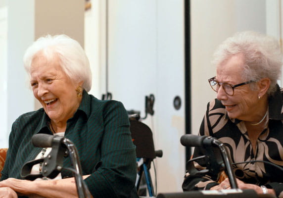 Members of the improv club laugh together.