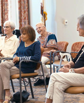 Improv members laugh together.