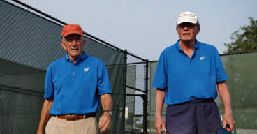 Gil Haggart and Jim Good walk onto the pickleball court.