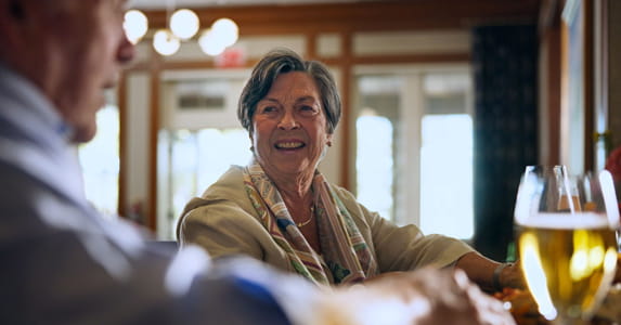 Mary Fields enjoys a glass of wine at the bar.