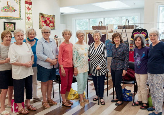 Members of TidePointe's needlecraft group.