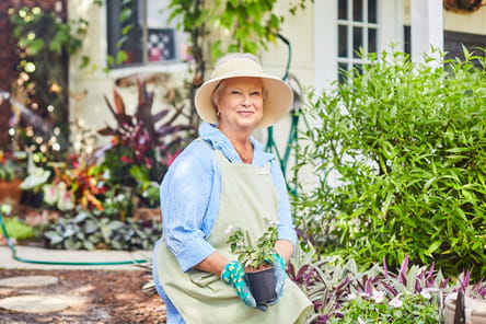 A woman gardens.