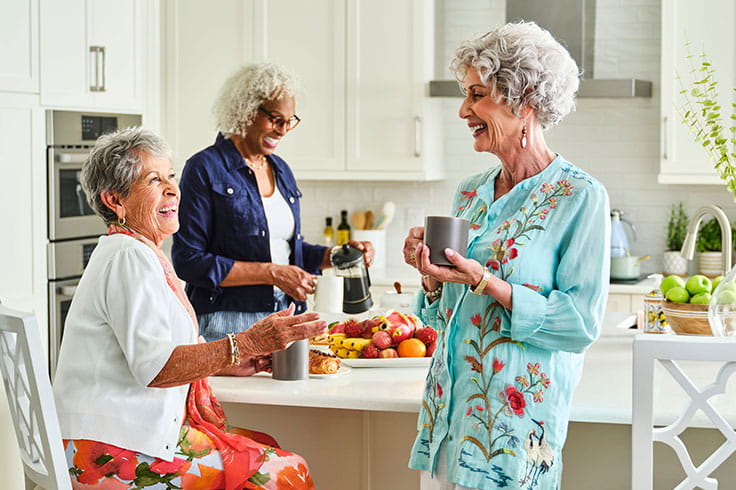 Women talking in the kitchen.