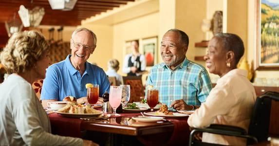 Residents dine together.