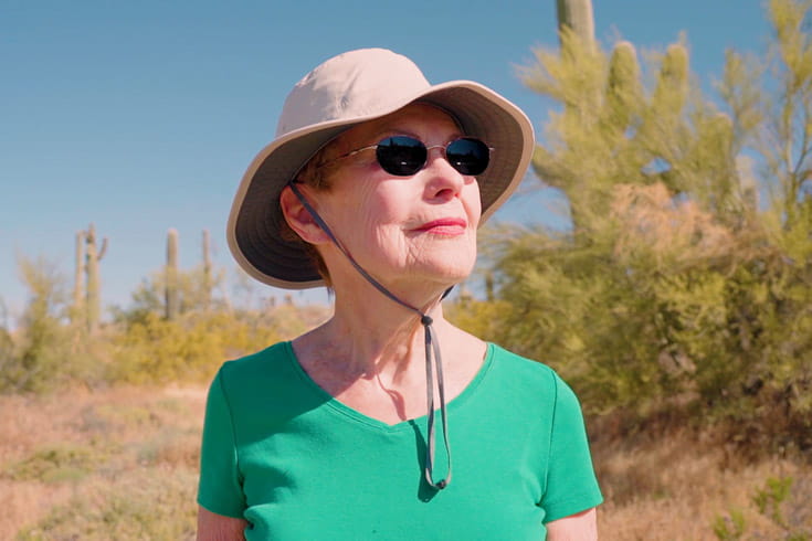 A hiking club participant looks into the distance.