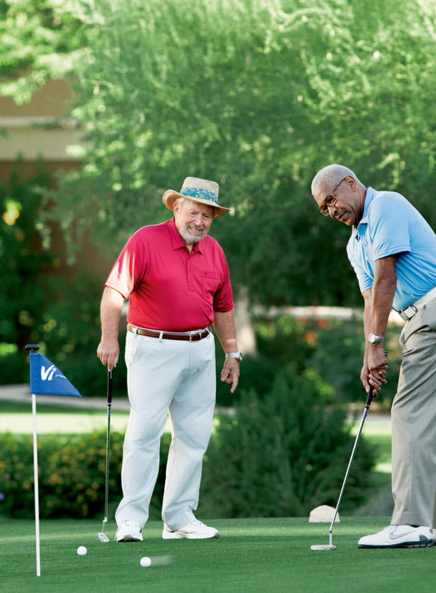 Two men golf at Vi at Silverstone.