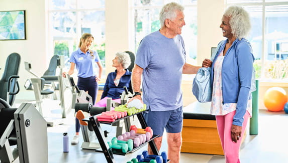 Residents socialize at the gym