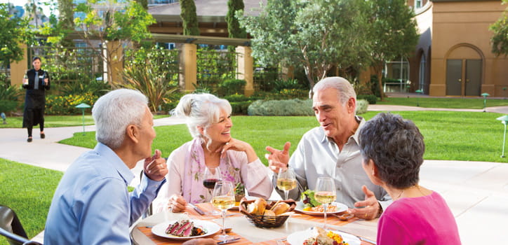 Four people dine al fresco at Vi at La Jolla Village.