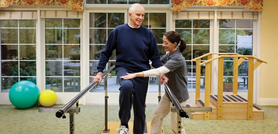 A man practices exercises in therapy.