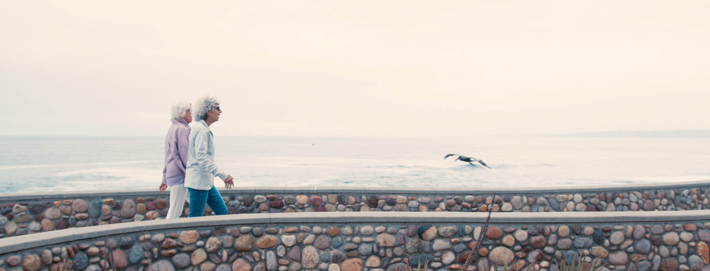 Vi residents walk on the San Diego coast.