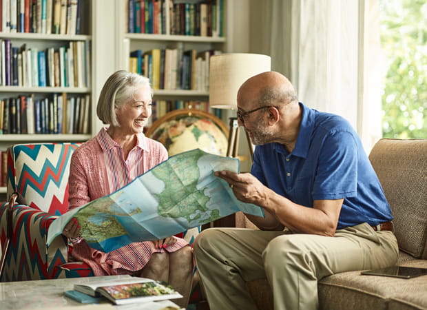A couple looks at a map together.