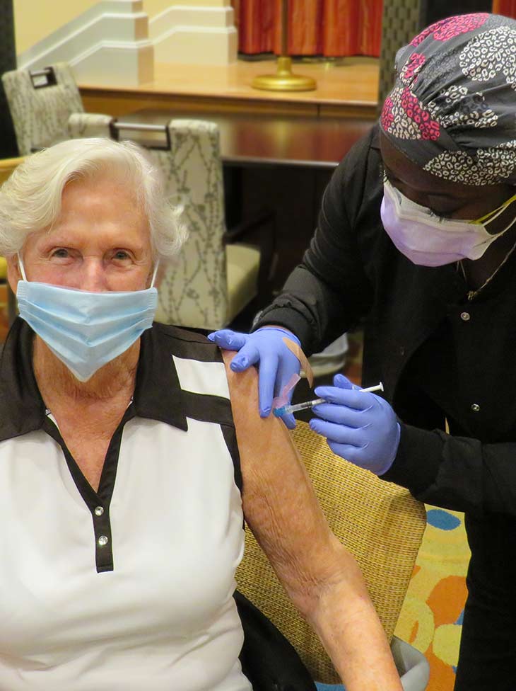 A Vi resident receives their vaccine