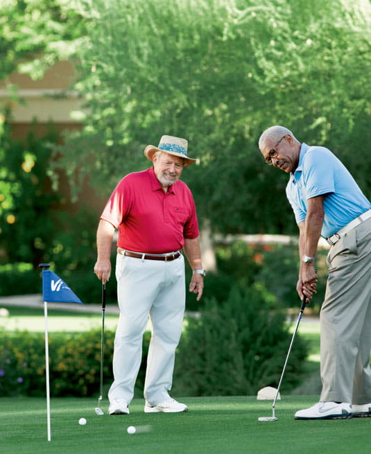 Two men golfing at Vi at Silverstone